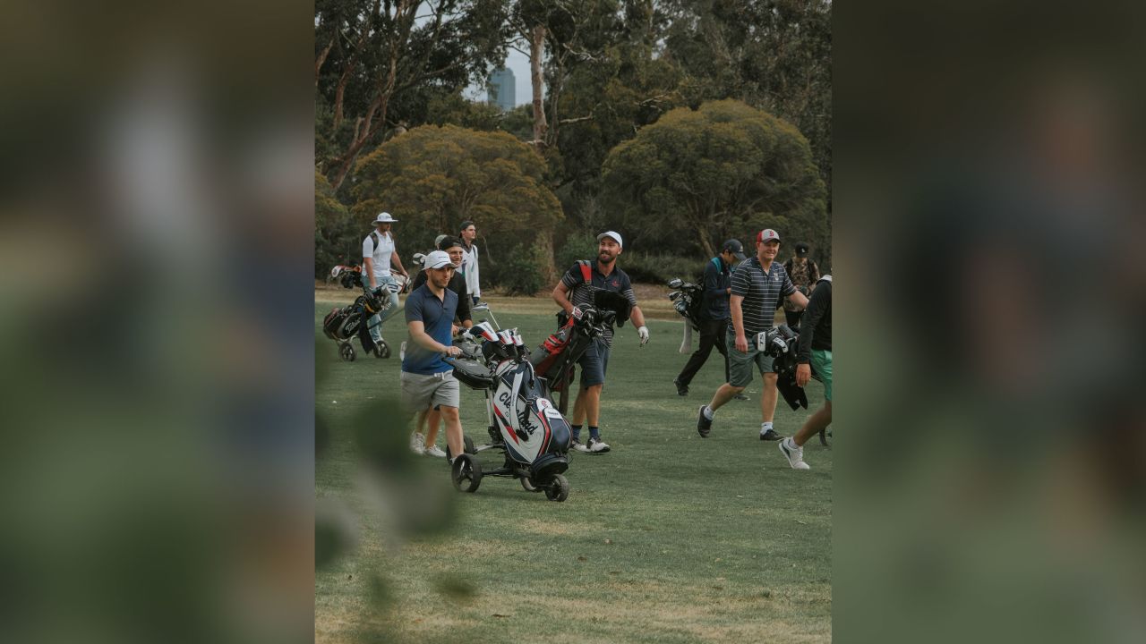 Players walk down the fairway during a round between Random Golf Club fans. 