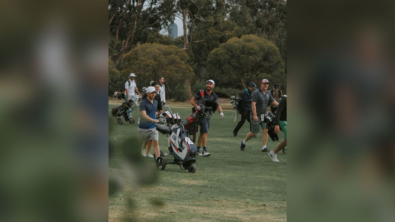 Players walk down the fairway during a round between Random Golf Club fans.