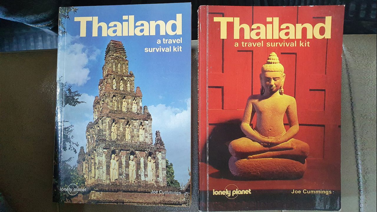 The 1st (1982) and 2nd (1984) editions of the Lonely Planet Thailand guide. 