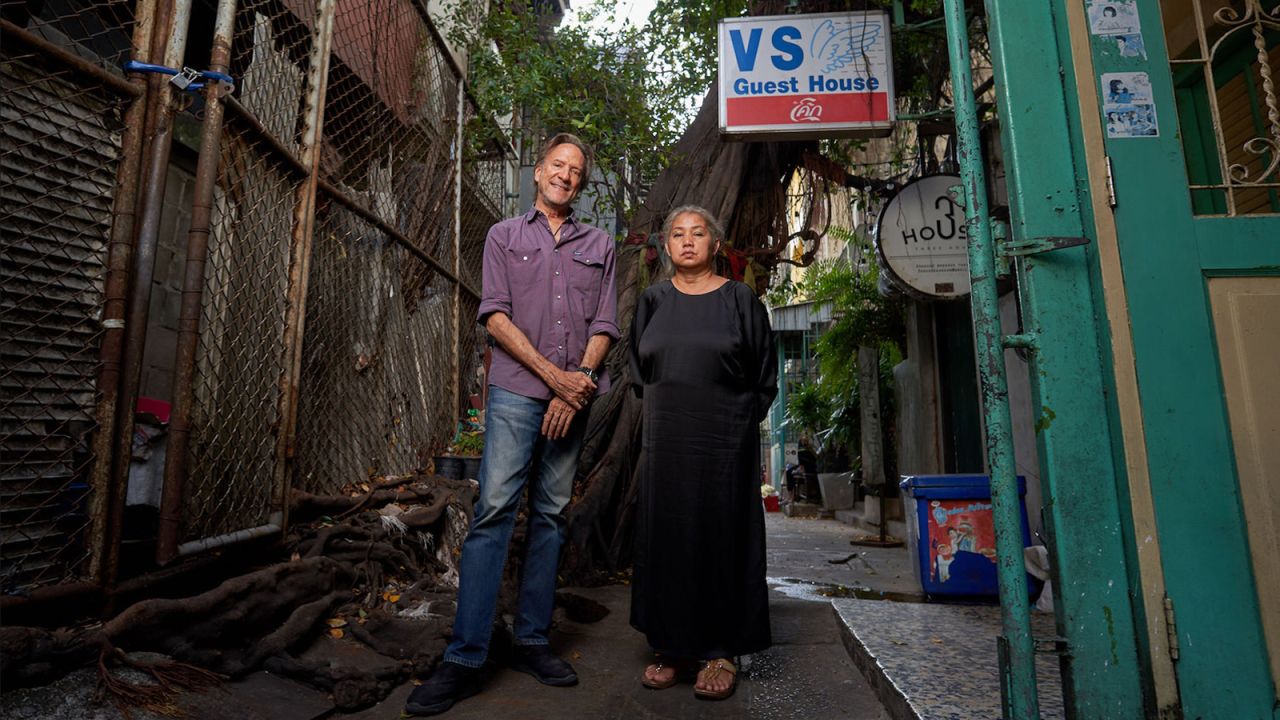 <strong>Still in business: </strong>Former Lonely Planet author Cummings stands with fourth generation VS Guest House owner Rintipa Detkajon during a January 2021 visit. 