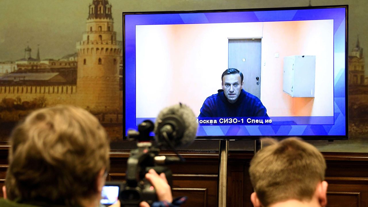 Opposition leader Alexei Navalny appears on a screen set up at a hall of the Moscow Regional Court via a video link from Moscow's penal detention centre Number 1 (known as Matrosskaya Tishina) during a court hearing of an appeal against his arrest, in Krasnogorsk outside Moscow on January 28, 2021. - Navalny, 44, was detained on January 17 upon returning to Moscow after five months in Germany recovering from a near-fatal poisoning with a nerve agent and later jailed for 30 days while awaiting trial for violating a suspended sentence he was handed in 2014. (Photo by Alexander NEMENOV / AFP) (Photo by ALEXANDER NEMENOV/AFP via Getty Images)