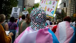 Supporters of Georgia's transgender and non-binary community stroll through the city's Midtown district during Gay Pride Festival's Transgender Rights March in Atlanta on Saturday, Oct. 12, 2019. (AP Photo/Robin Rayne)