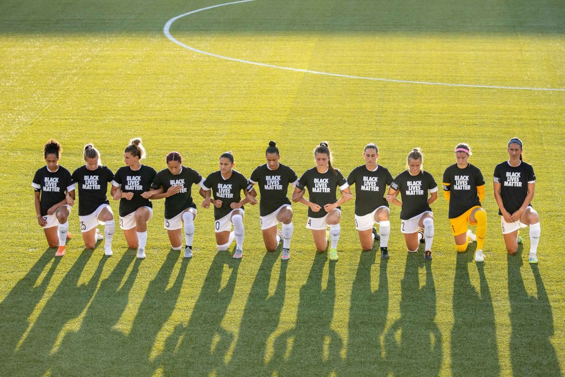 North Carolina Courage players kneel during the national anthem during a game against the Washington Spirit.