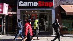 People walk by a GameStop store in Brooklyn on January 28, 2021 in New York City. Markets continue a volatile streak with the Dow Jones Industrial Average rising over 500 points in morning trading following yesterdays losses. Shares of the video game retailer GameStop plunged. (Photo by Spencer Platt/Getty Images)
