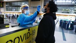 A man receives a nasal swab COVID-19 test at Tom Bradley International Terminal at Los Angeles International Airport (LAX) amid a coronavirus surge in Southern California on December 22, 2020 in Los Angeles, California.
