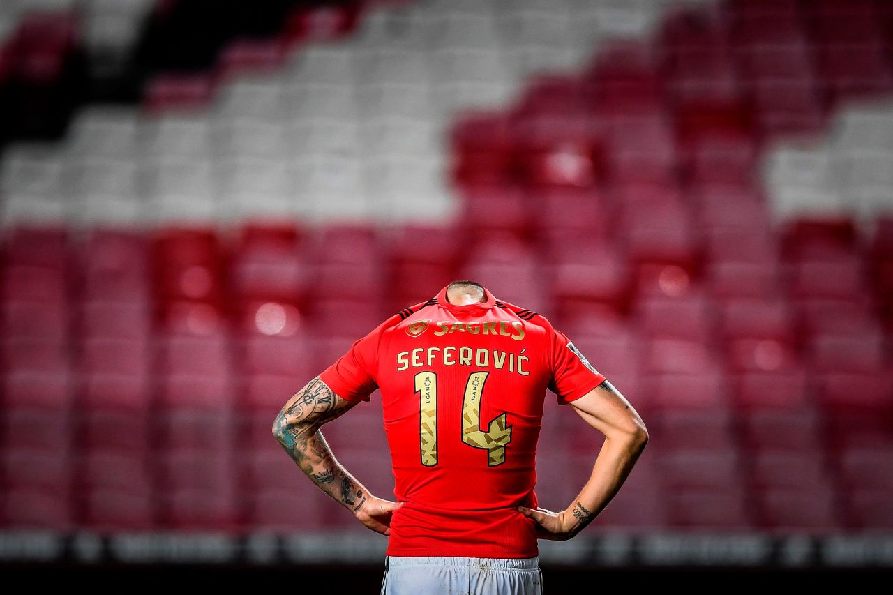 Benfica soccer player Haris Seferovic hides his head under his jersey at the end of a Portuguese league match against Nacional on Monday, January 25. The match in Lisbon ended 1-1.