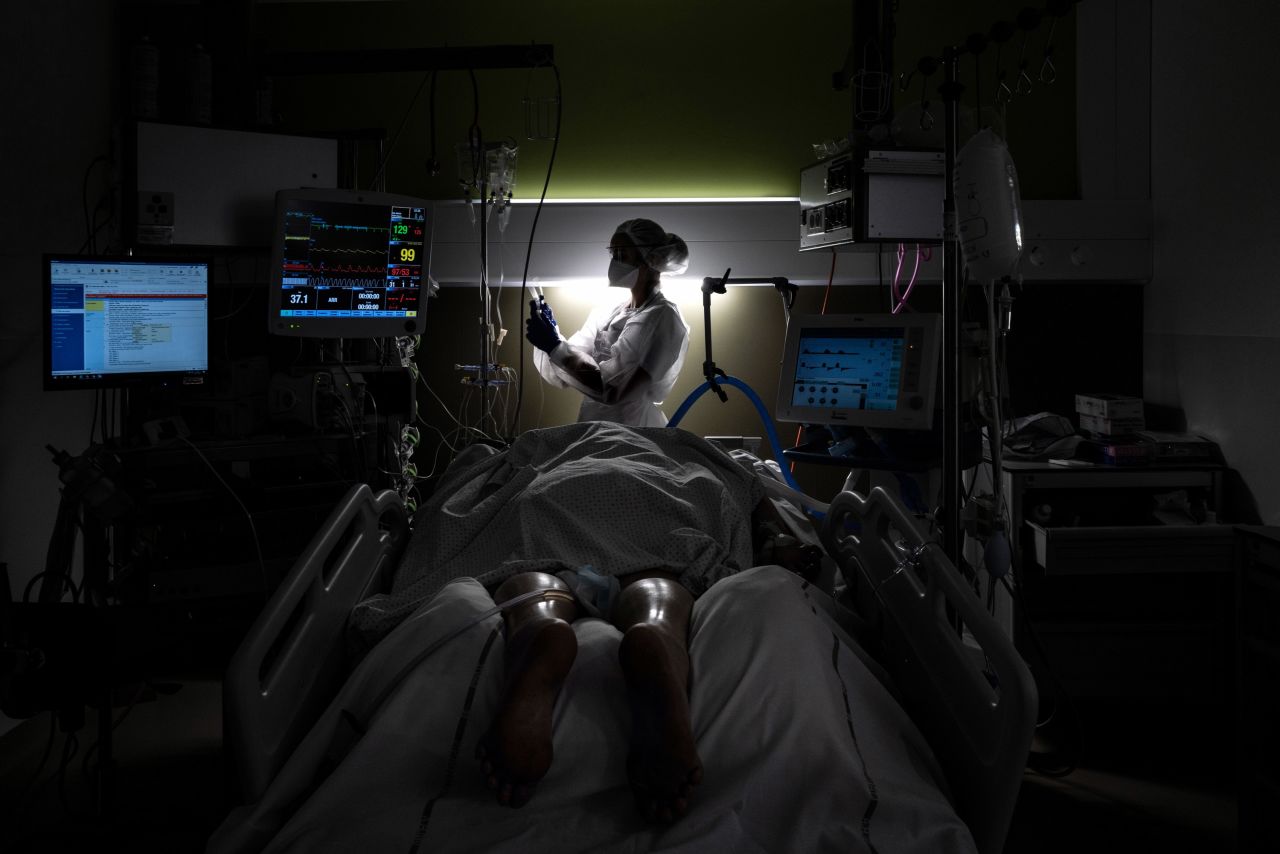 A nurse takes care of a Covid-19 patient at a hospital in Pierre-Benite, France, on Monday, January 25. 
