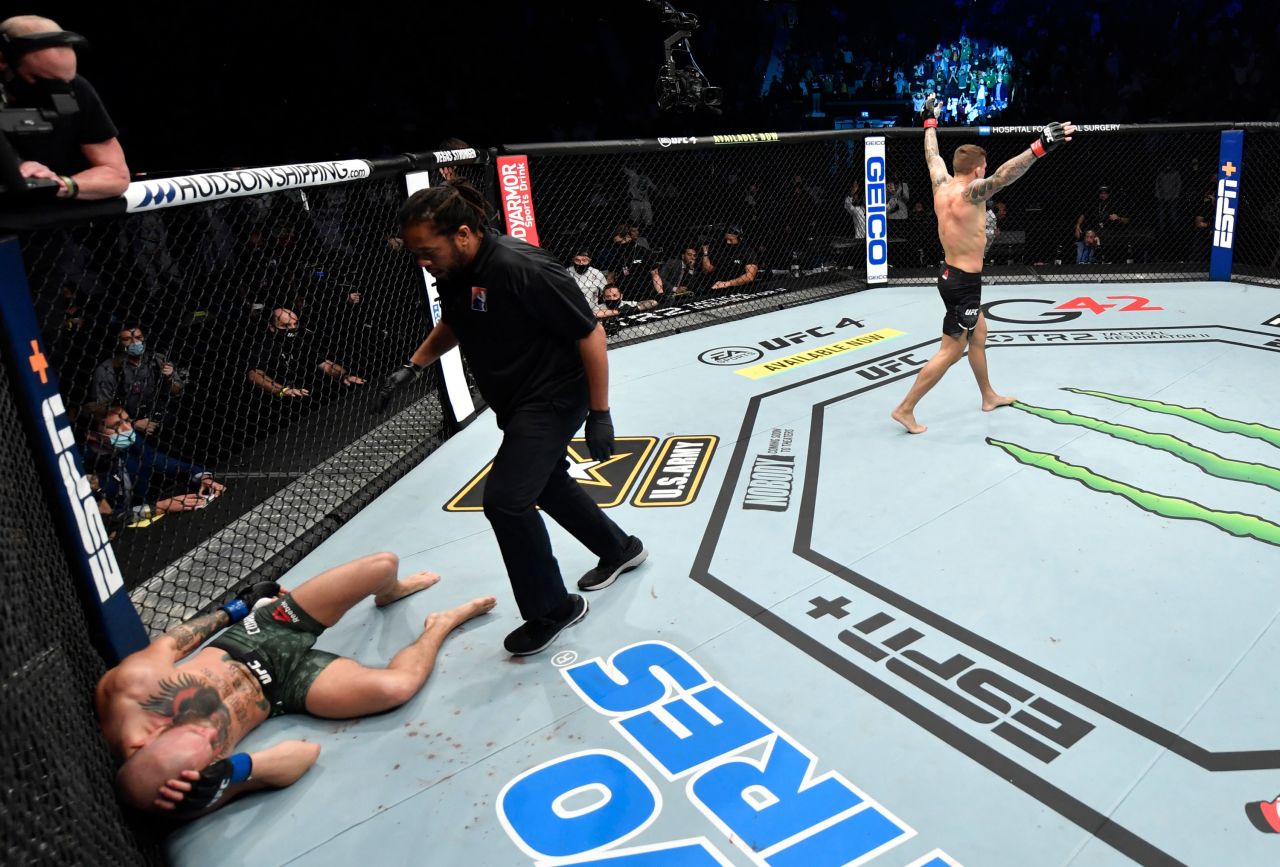 Dustin Poirier celebrates after knocking out Conor McGregor in their UFC bout on Saturday, January 23.