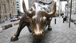 The Charging Bull Statue stands a few blocks from the New York Stock Exchange before the opening bell at the NYSE on Wall Street in New York City on Friday, January 22, 2021. The Dow Jones Industrial Average began the day down over 200 points.