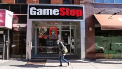 People walk by a GameStop store in Brooklyn on January 28, 2021 in New York City. Markets continue a volatile streak with the Dow Jones Industrial Average rising over 500 points in morning trading following yesterdays losses. Shares of the video game retailer GameStop plunged. (Photo by Spencer Platt/Getty Images)