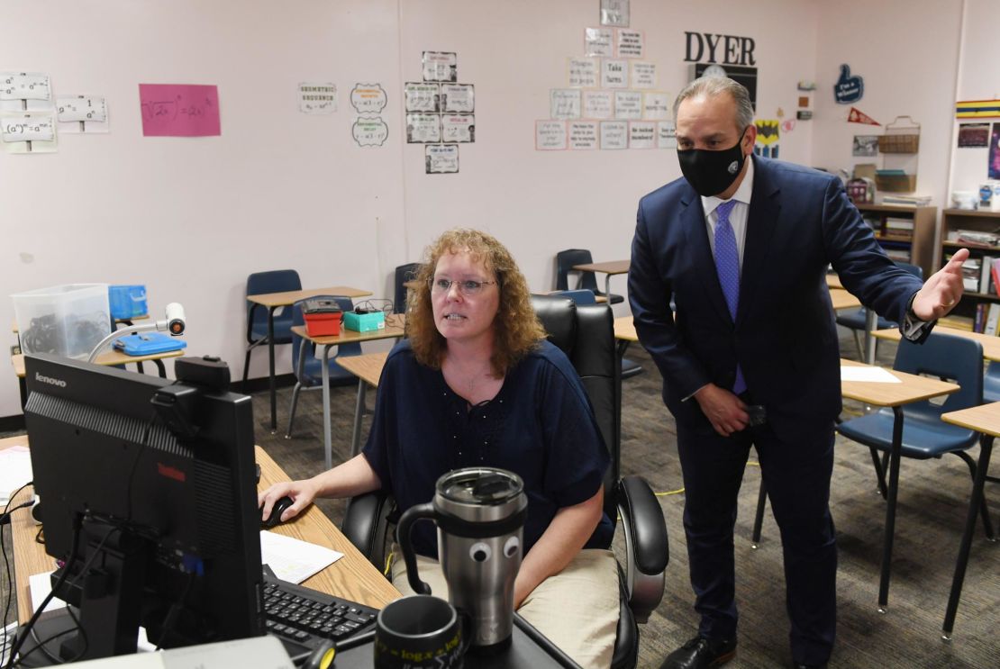 Clark County School District Superintendent Jesus Jara, here checking on a teacher running an online algebra class, says there is just no substitute for in-person interaction.