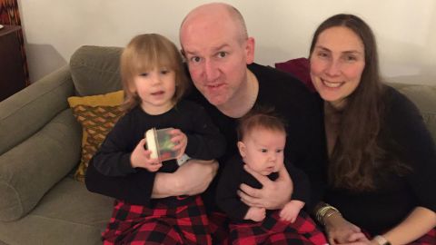Martin and Pamela Addison smile with their children Elsie, left, and Graeme.