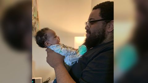 Leslie Lamar Parker holds his son, Chance.