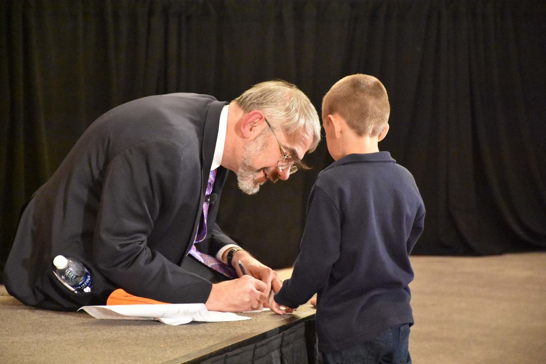 Kastner is shown in 2016 at the inaugural DADA2 conference in Bethesda, Maryland, with a boy who has DADA2, an autoinflammatory disorder. The award-winning scientist identified the genetic mutation that causes the disease and also helped develop treatments.