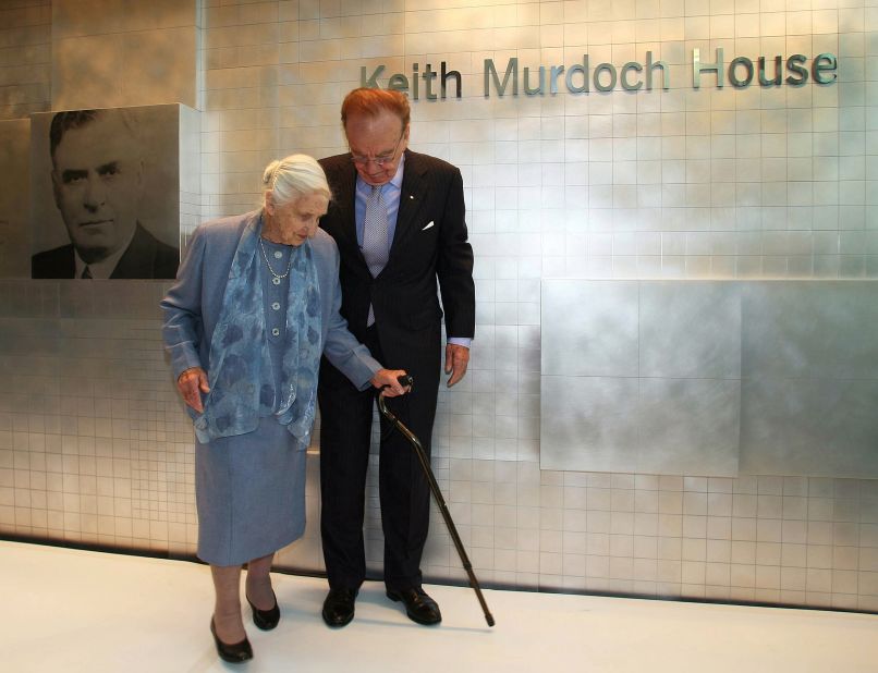 Murdoch walks alongside his mother, Elisabeth, at the opening of a new newspaper office building in Adelaide, Australia, in 2005. The building was named after his father, Keith. Murdoch's mother was a beloved philanthropist in Australia who devoted her life to charities. She died in 2012.