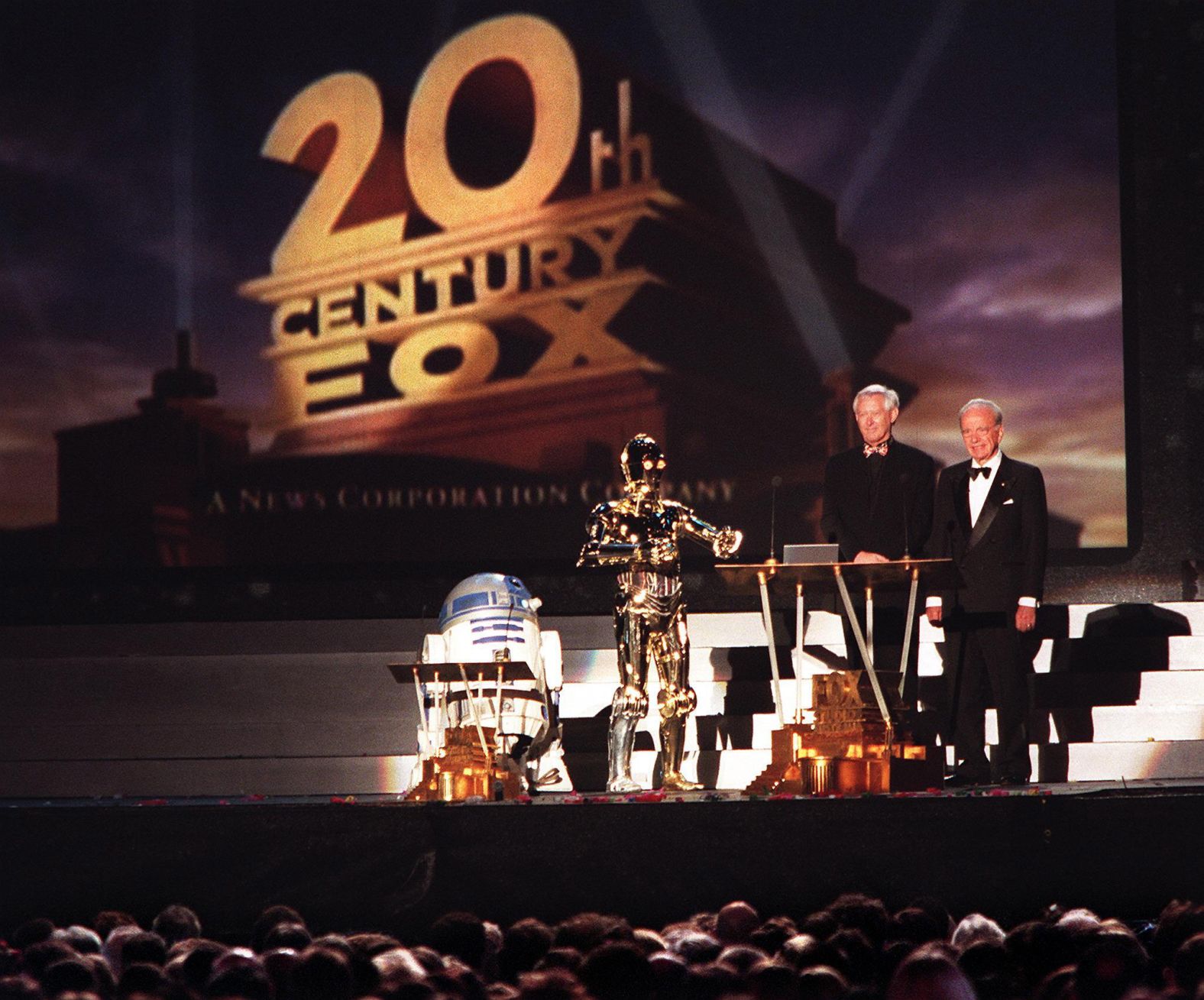Murdoch, right, and Stuart Horney are joined by "Star Wars" characters R2D2 and C3PO as they officially open Fox Studios Australia in 1999.