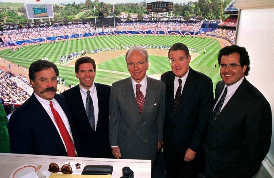 Murdoch, center, poses from the owners box at Dodger Stadium in 1998. From 1998 to 2004, Murdoch owned the Los Angeles Dodgers baseball team.