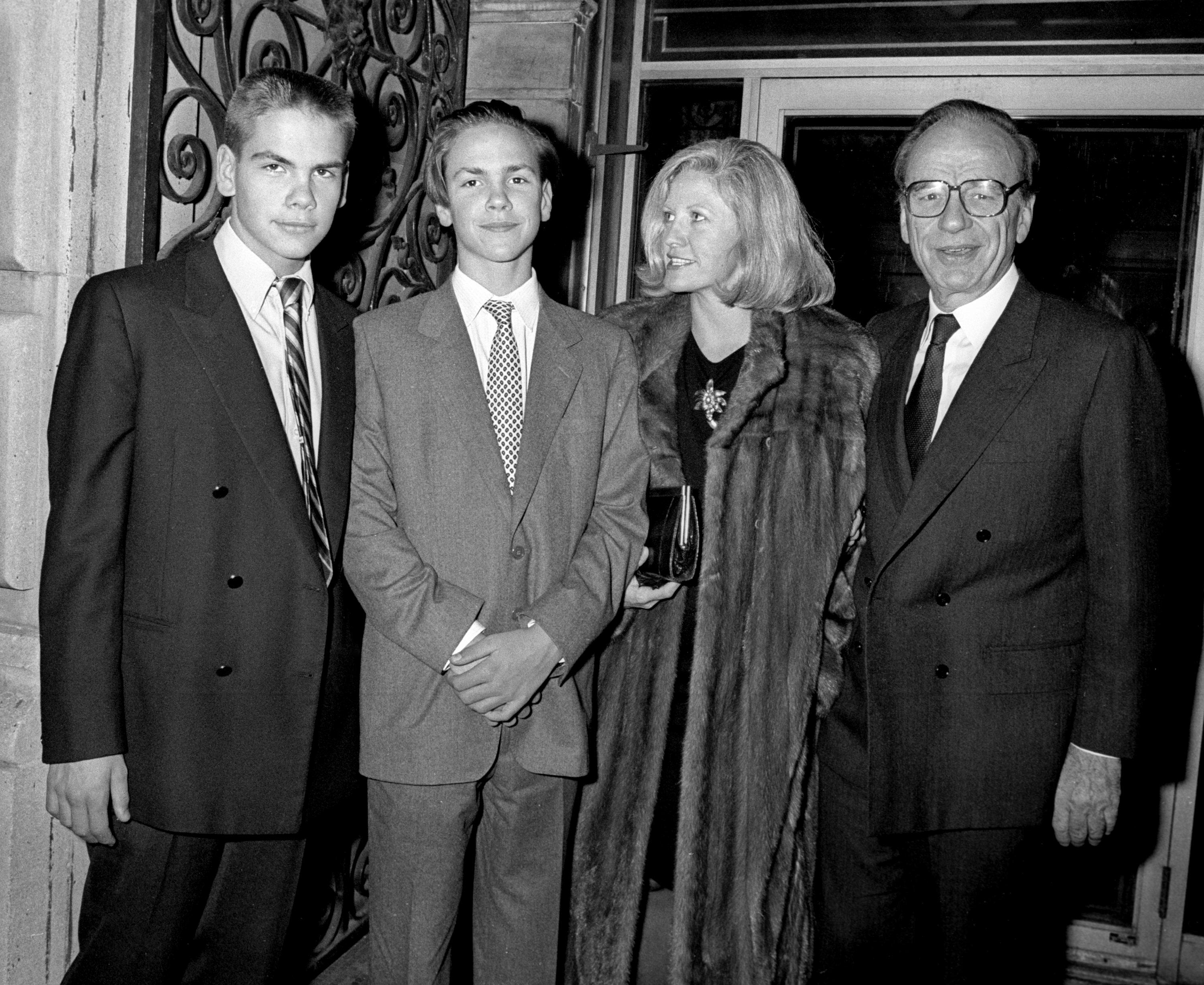 Murdoch, left, is seen with his wife, Anna, and their sons as they attend the movie premiere of 'Broadcast News' in 1987.