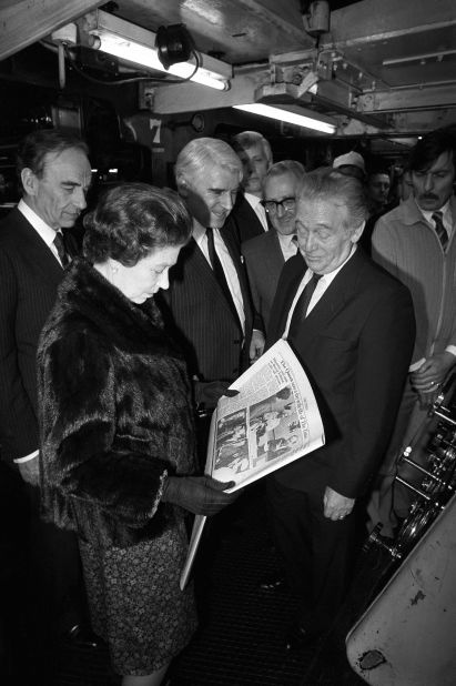 Murdoch, left, is seen with Queen Elizabeth II in 1985 as she toured the Times newspaper building to mark the paper's bicentenary.