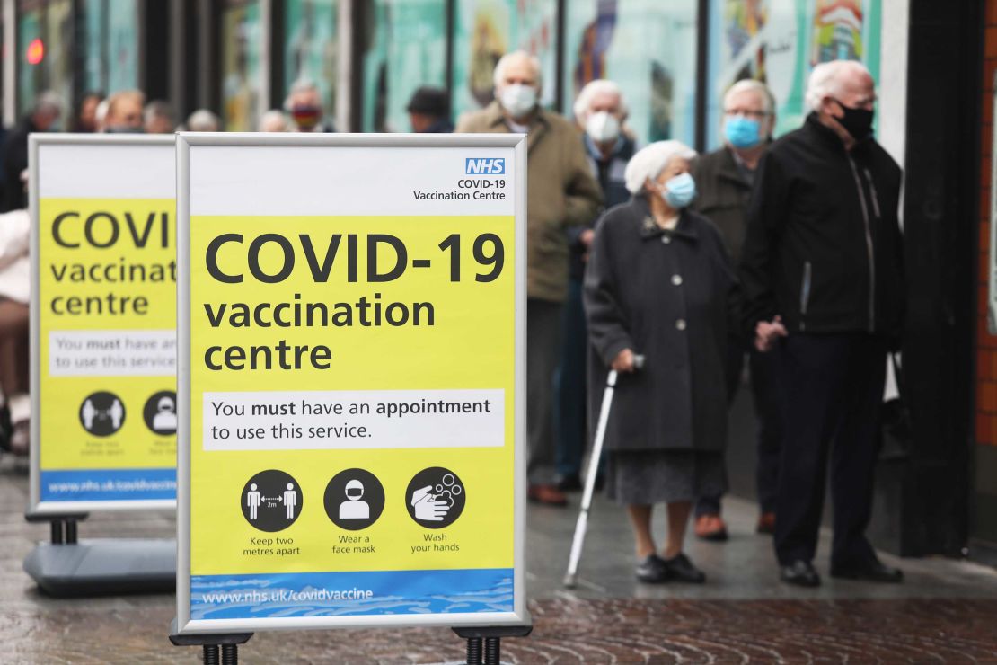 People queue before receiving the Oxford/AstraZeneca vaccine in Folkestone, southern England on January 27.