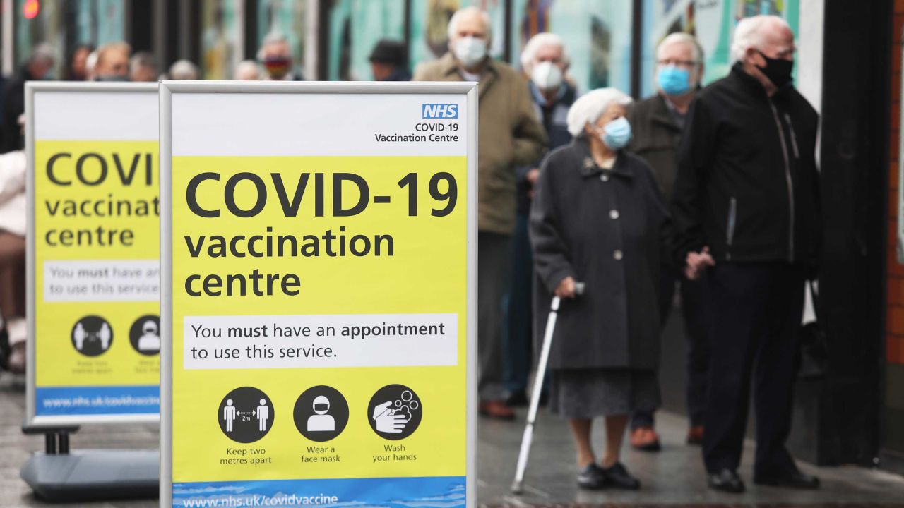 People queue before receiving the Oxford/AstraZeneca vaccine in Folkestone, southern England on January 27.