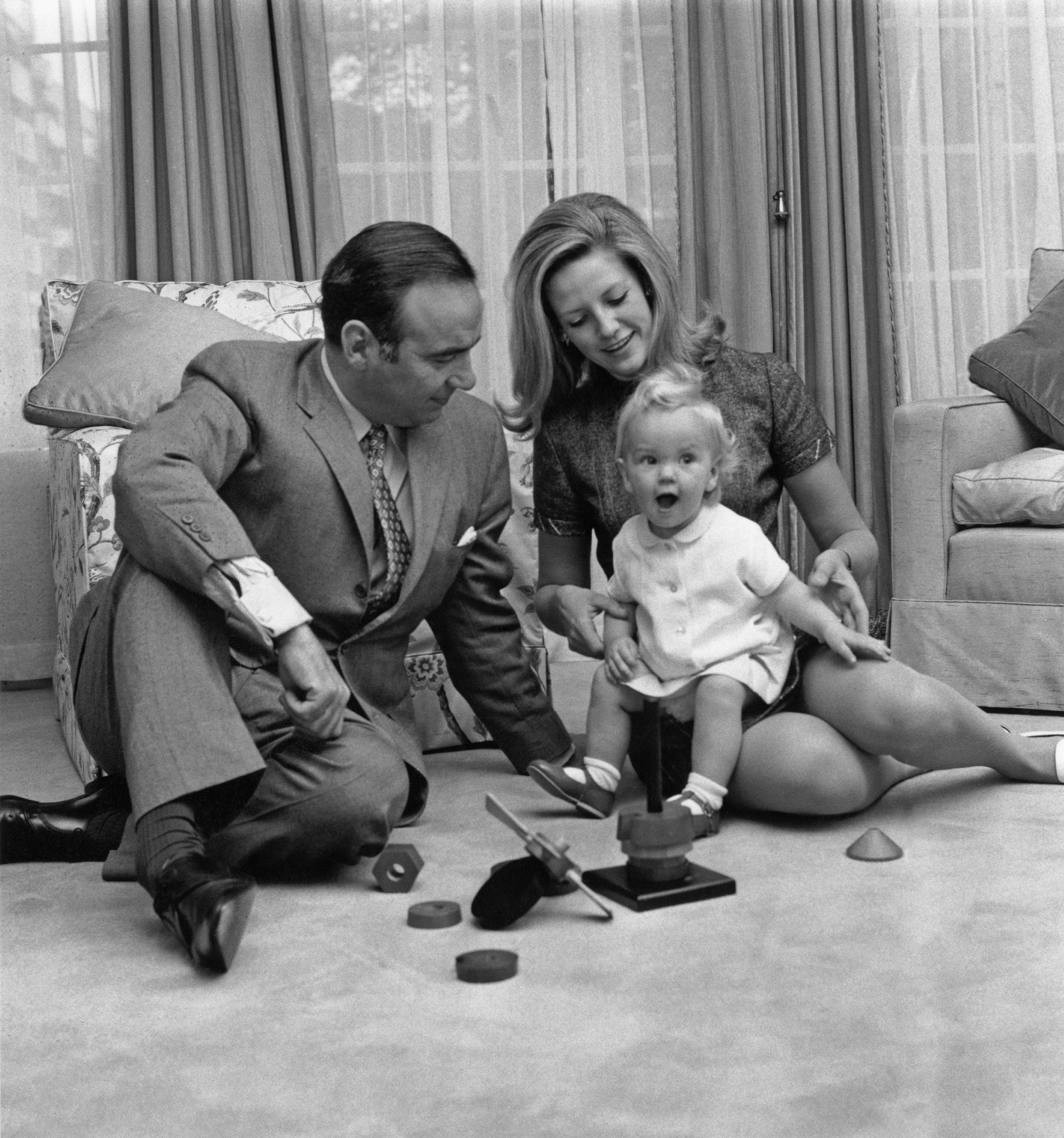 Murdoch and his second wife, Anna, watch their 14-month old daughter, Elisabeth, at their home in London in 1969.