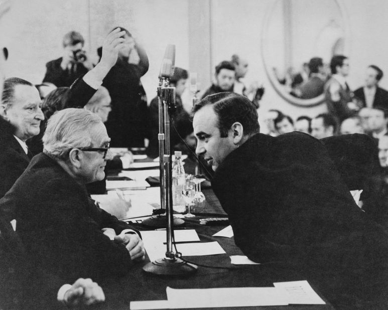 Murdoch attends a shareholders meeting for the London newspaper News of the World in 1969. He gained control of the paper as well as The Sun, which he transformed into a tabloid.