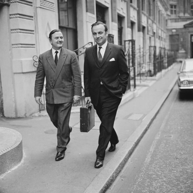 Murdoch, right, walks in London with British banker and businessman Stephen Catto in 1968.