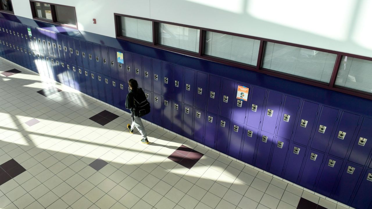 A student walks the halls between classes on January 25, the first day of in-person learning at Arvada West High School in Colorado.