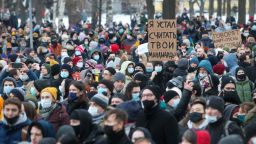 ST PETERSBURG, RUSSIA - JANUARY 31, 2021: Demonstrators attend an unauthorised protest in support of the detained opposition activist Alexei Navalny. The message on the sign in the centre reads: "I am tired of counting your billions." Navalny, who had been handed a suspended sentence in the Yves Rocher case in 2014, was detained at Sheremetyevo Airport near Moscow on 17 January 2021 for violating probation conditions. A court ruled that Navalny be put into custody until 15 February 2021. Alexander Demianchuk/TASS (Photo by Alexander Demianchuk\TASS via Getty Images)