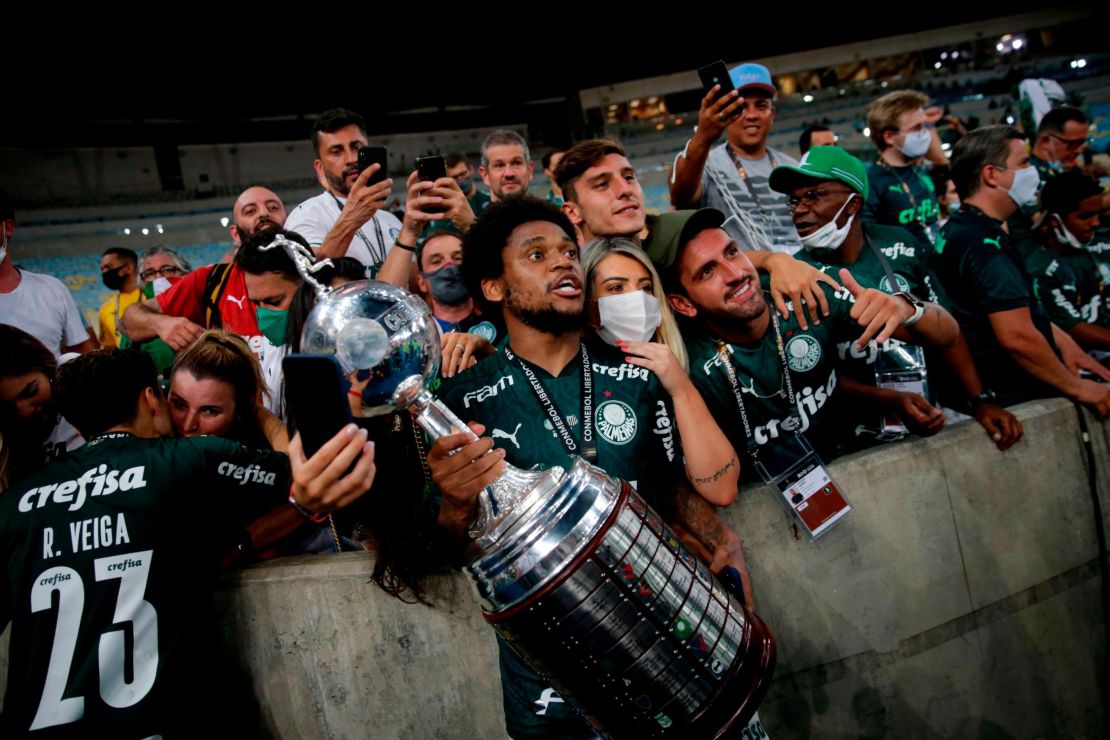 Palmeiras players celebrate with the limited number of fans allowed into the stadium. 