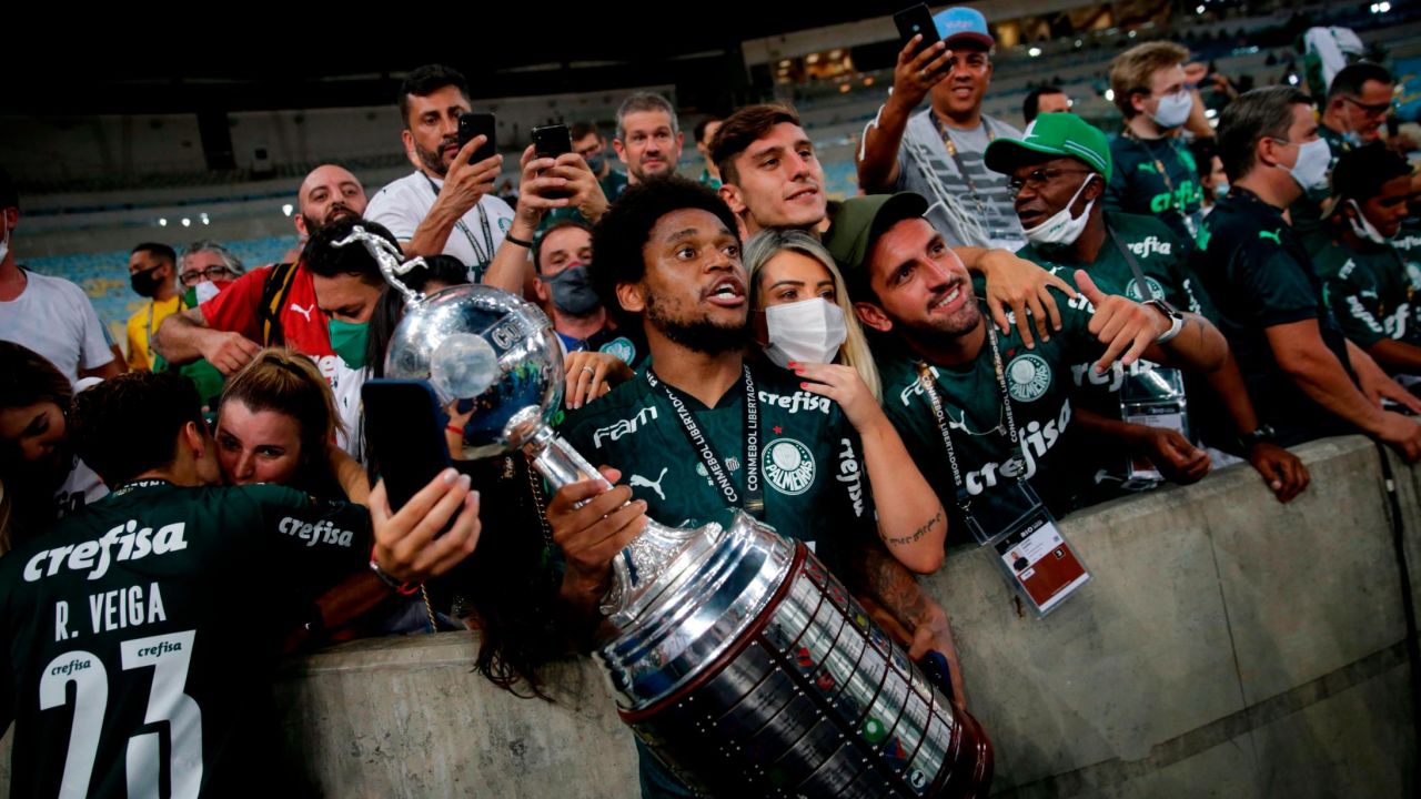 Palmeiras players celebrate with the limited number of fans allowed into the stadium. 