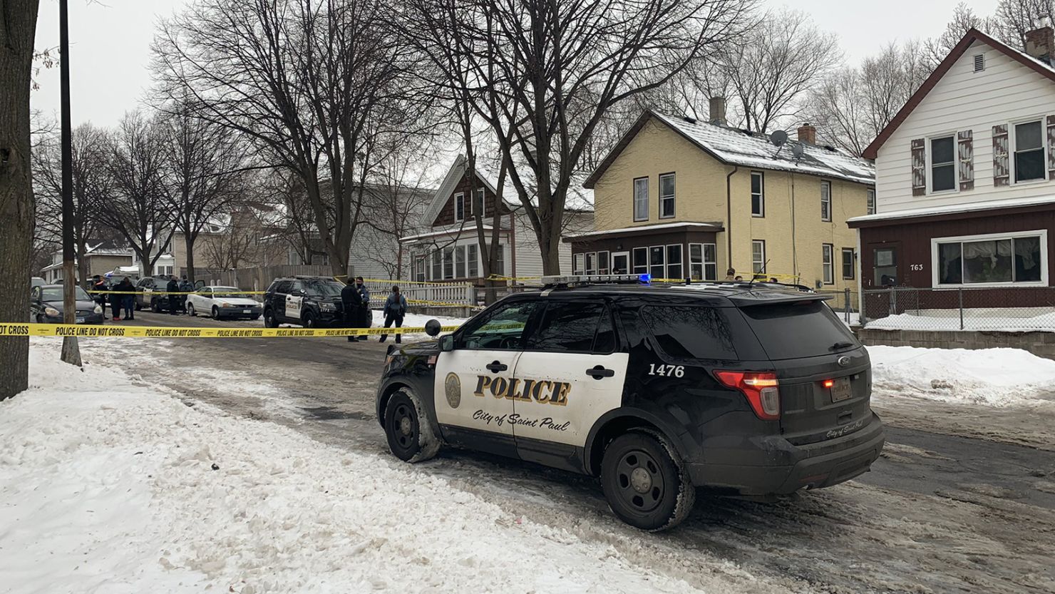 Officers and investigators at the scene of a shooting in St. Paul, Minnesota.