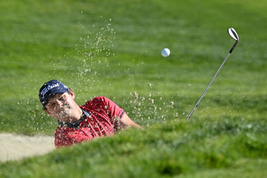 Reed hits from the bunker on the 1st hole during the final round of the Farmers Insurance Open.