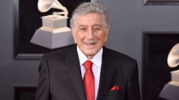 FILE - Tony Bennett arrives at the 60th annual Grammy Awards in New York on Jan. 28, 2018. Bennett has been diagnosed with Alzheimer's disease but the diagnosis hasn't quieted his legendary voice. The singer's wife and son reveal in the latest edition of AARP The Magazine that Bennett was first diagnosed in 2016.  The magazine says he endures "increasingly rarer moments of clarity and awareness."(Photo by Evan Agostini/Invision/AP, File)