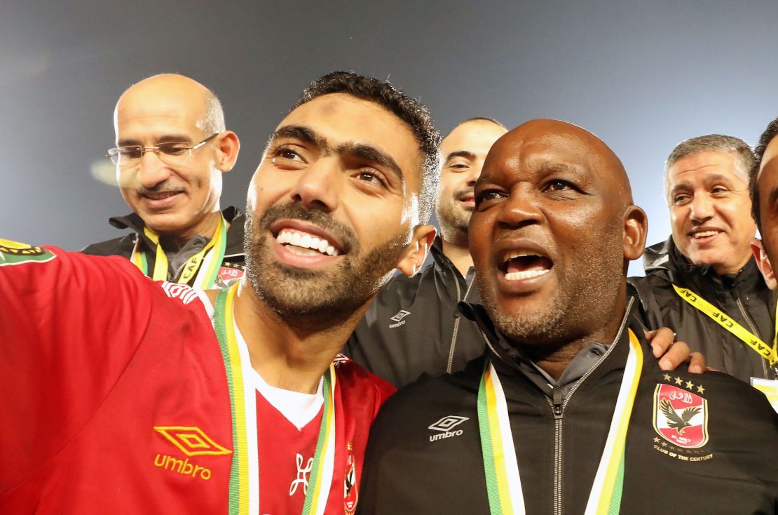 Al-Ahly player Hussein El Shahat (L) and head coach Pitso Mosimane (R) celebrate after winning the CAF Champions League final soccer match Zamalek vs Al-Ahly at Cairo International Stadium in Cairo, Egypt, 27 November 2020.