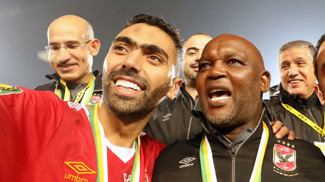 Al-Ahly player Hussein El Shahat (L) and head coach Pitso Mosimane (R) celebrate after winning the CAF Champions League final soccer match Zamalek vs Al-Ahly at Cairo International Stadium in Cairo, Egypt, 27 November 2020.