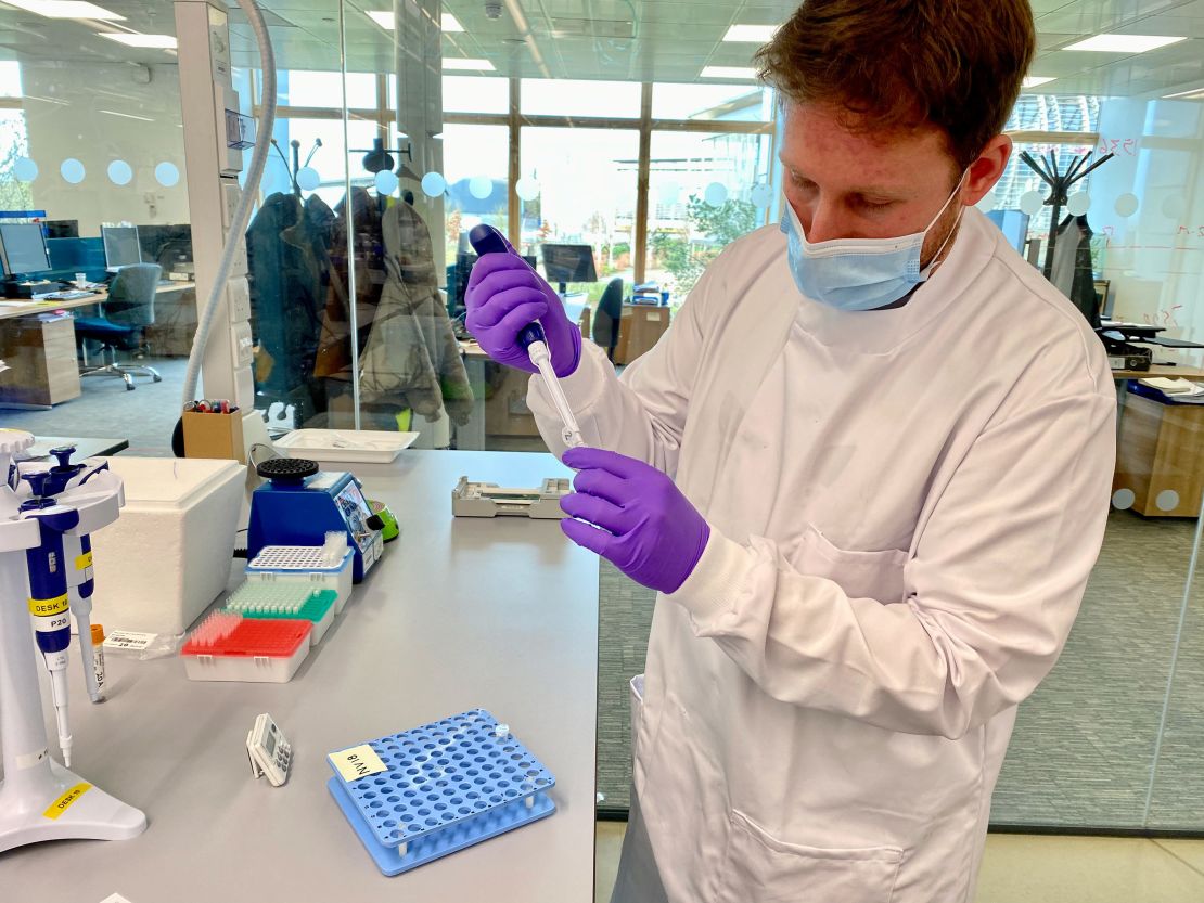 A scientist at the Sanger Institute prepares the Covid-19 samples for sequencing. More than 700 positive samples are sequenced in a single run of one machine, which takes around five days.
