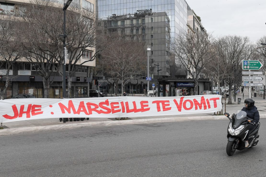 A protest banner against club president Jacques-Henri Eyraud reads: "JHE: Marseille vomits you."