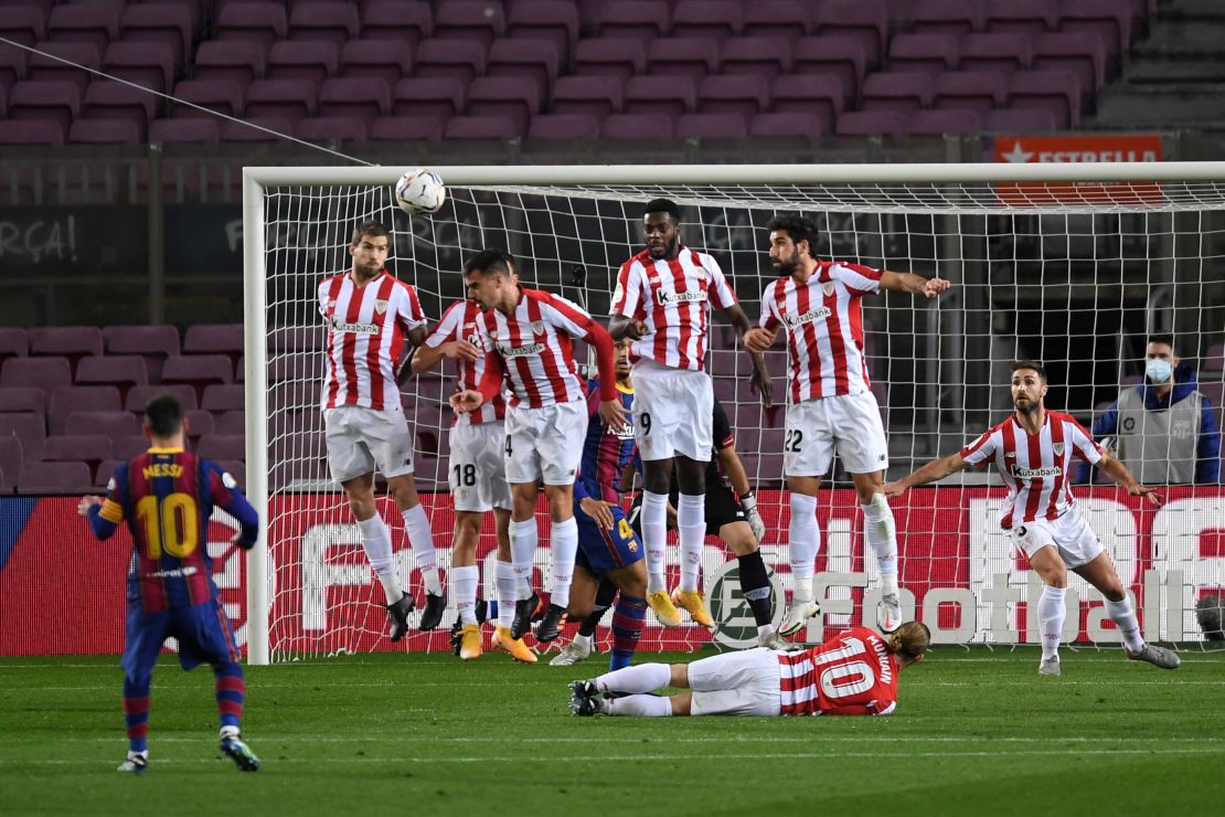 Messi scores a free-kick against Athletic Bilbao on Sunday. 