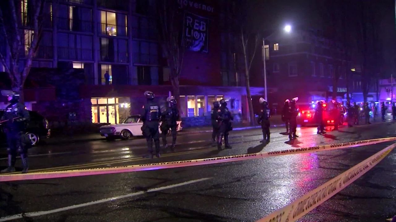 At least seven people were taken into custody on Sunday as law enforcement cleared the Red Lion Hotel in downtown Olympia, Washington.