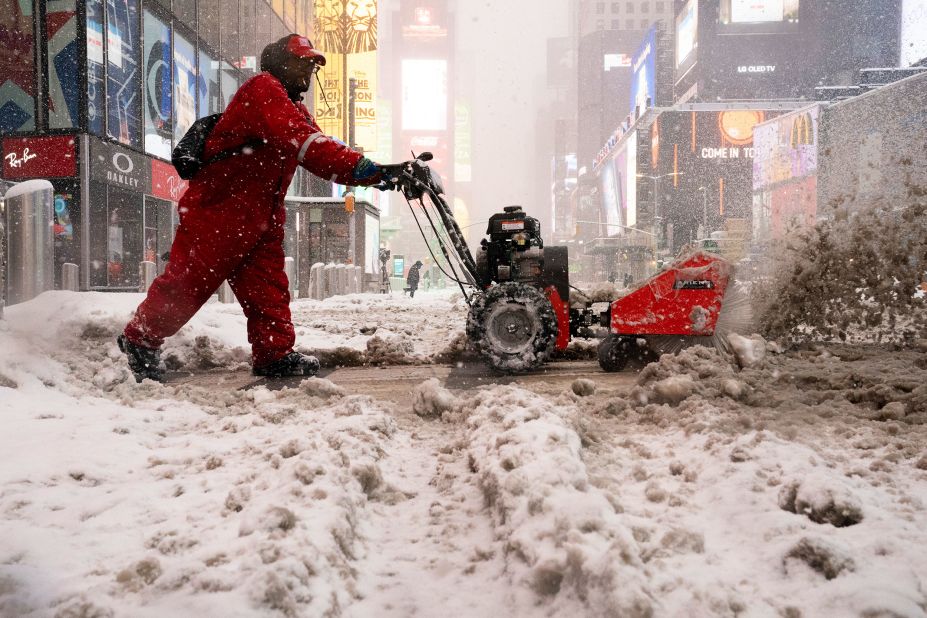 A worker clears sidewalks in Times Square on Monday.