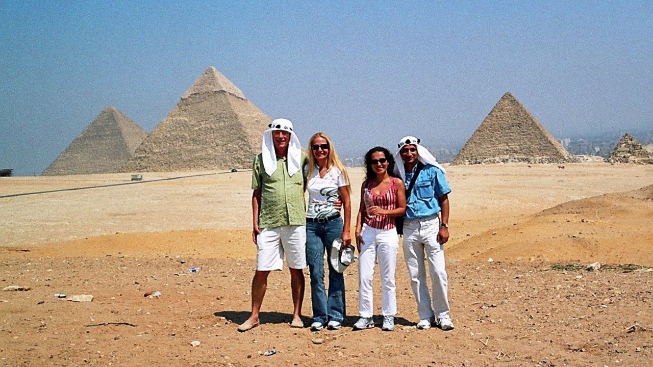 The couple, pictured right, with Feliciano's sister and brother-in-law in Cairo, Egypt in 2004.
