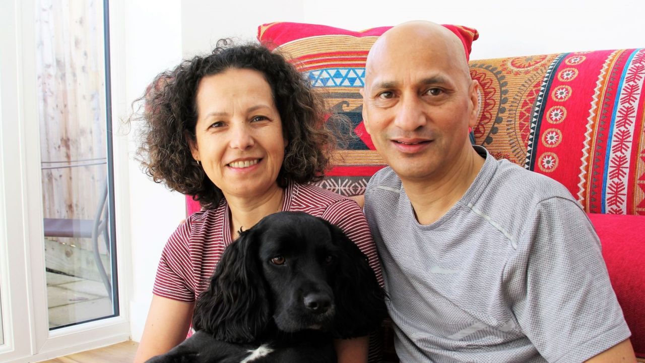 A recent photo of Feliciano and Sah with their dog, Ziggy.