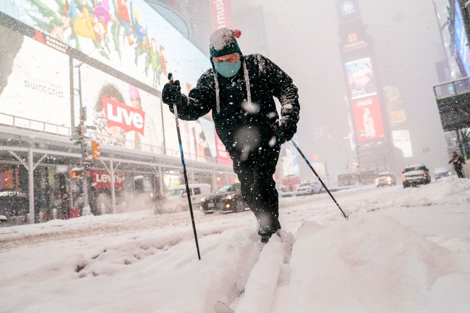 Steve Kent skis through New York's Times Square on Monday.