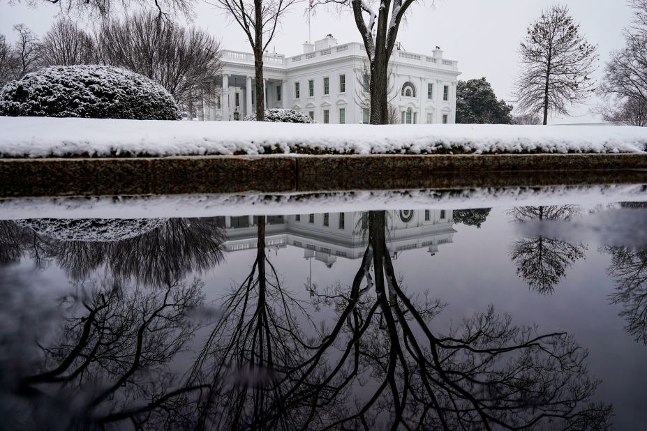 The White House grounds are covered in snow on Sunday.