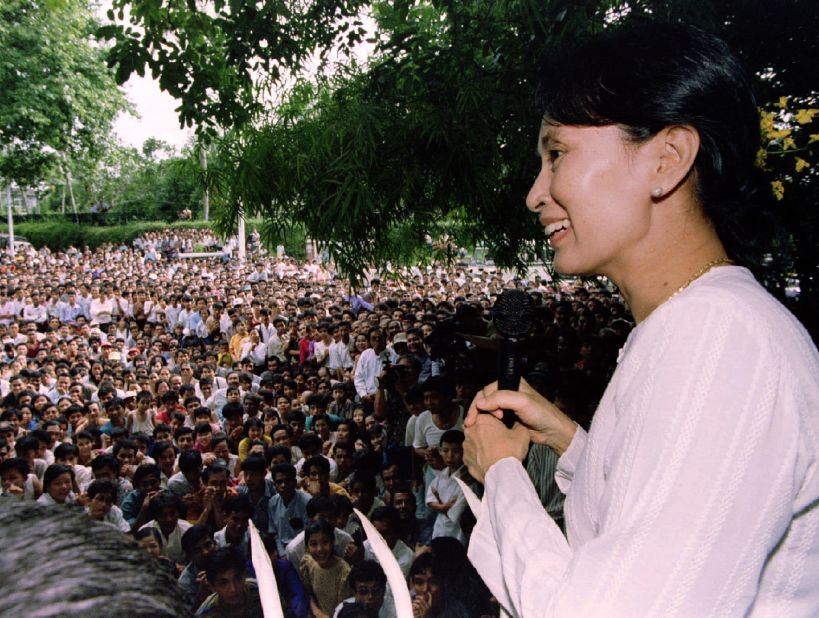 Suu Kyi speaks to hundreds of supporters from the gate at her residential compound in Yangon in 1995. She had just been released from house arrest, but her political activity was restricted.