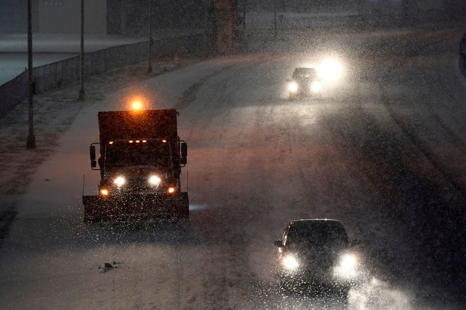 A truck salts Route 120 near MetLife Stadium in East Rutherford, New Jersey, on Sunday night.