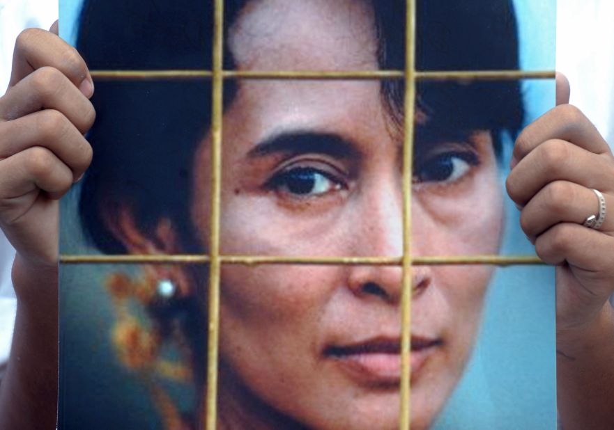 An activist holds a Suu Kyi portrait during a protest at the Chinese Embassy in Bangkok, Thailand, in 2009. The protesters were calling on the Chinese government to impose sanctions on Myanmar's military government following a Suu Kyi trial.