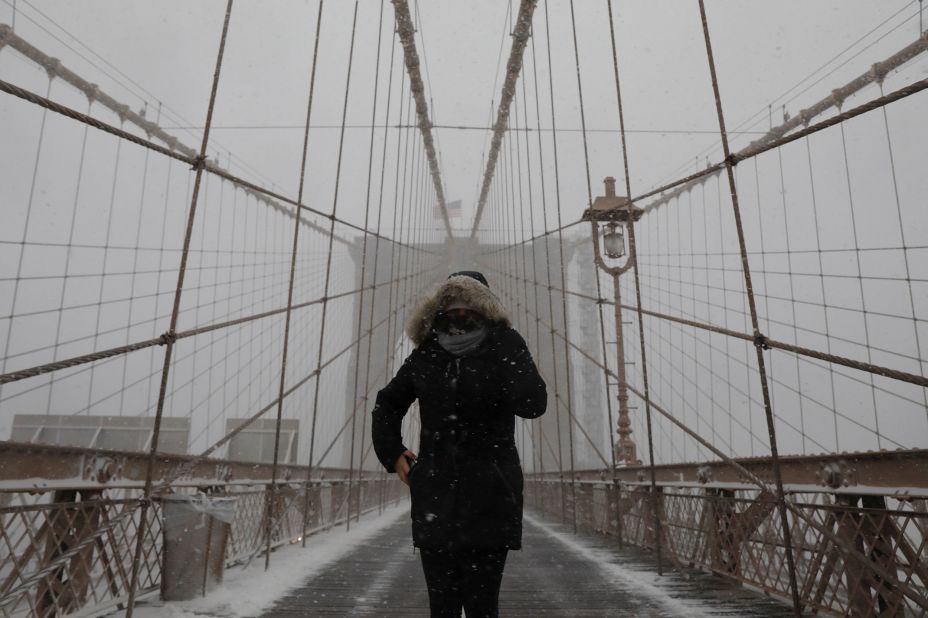 A person walks through New York's Brooklyn Bridge on Monday.